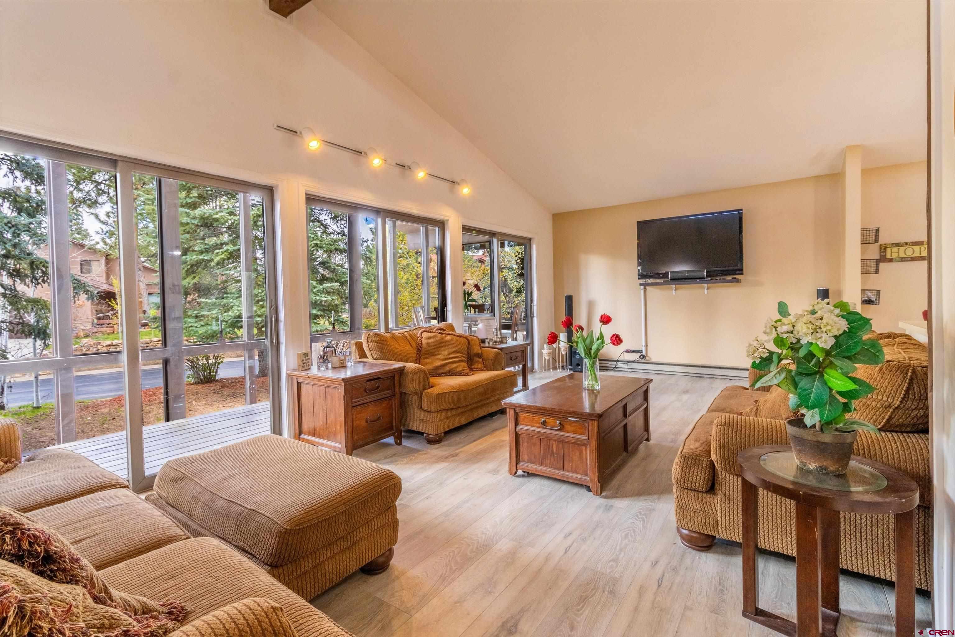 67 Pine Ridge Loop Durango, CO 81301 - Photo 3 of 35 a living room with furniture and a flat screen tv
