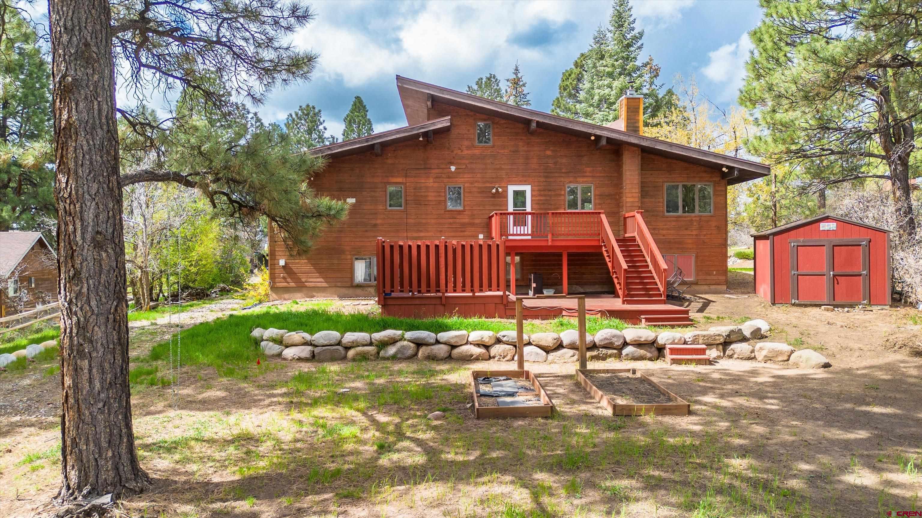 67 Pine Ridge Loop Durango, CO 81301 - Photo 31 of 35 a view of a house with backyard and garden