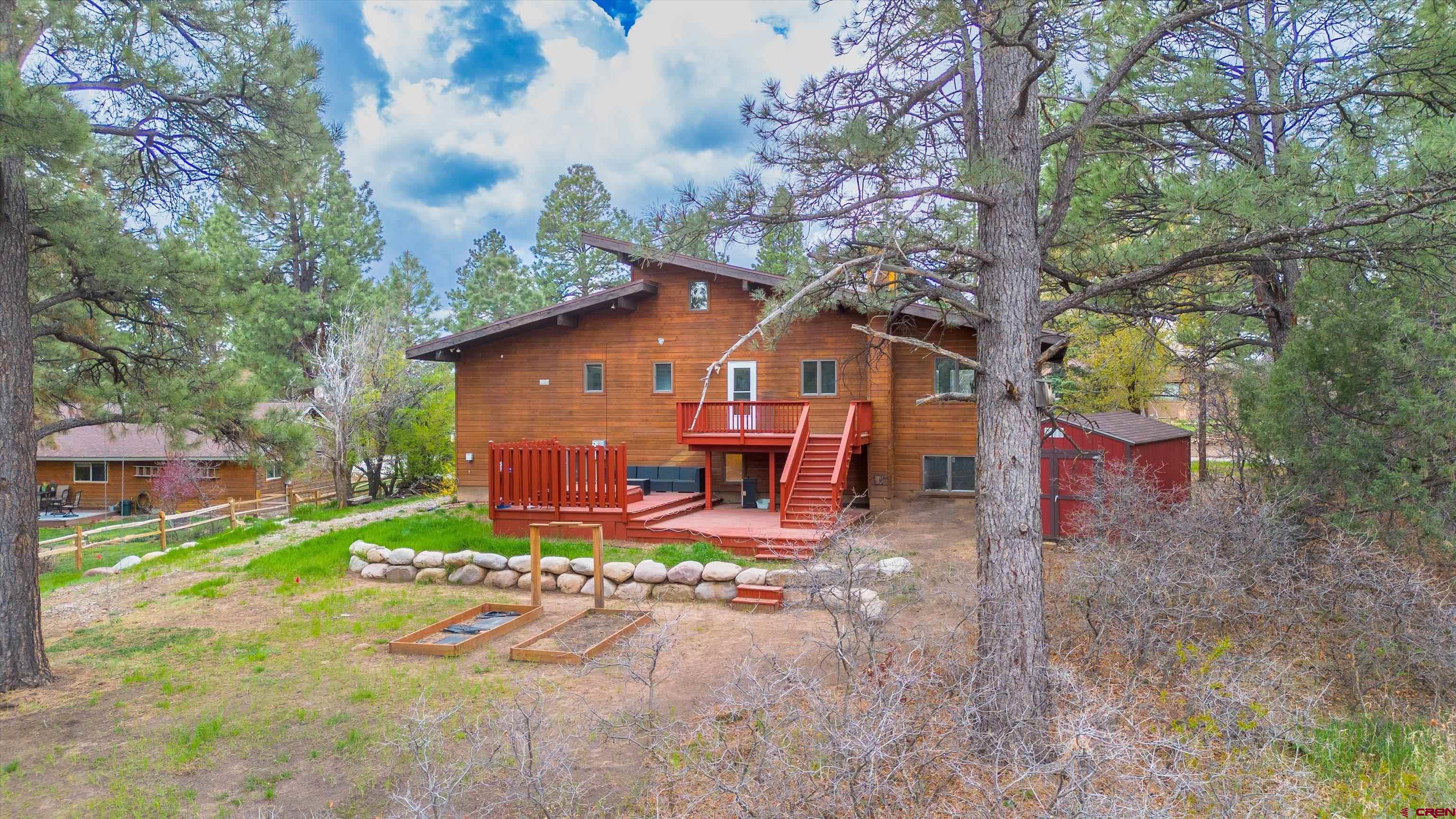 67 Pine Ridge Loop Durango, CO 81301 - Photo 32 of 35 a view of a house with backyard and sitting area