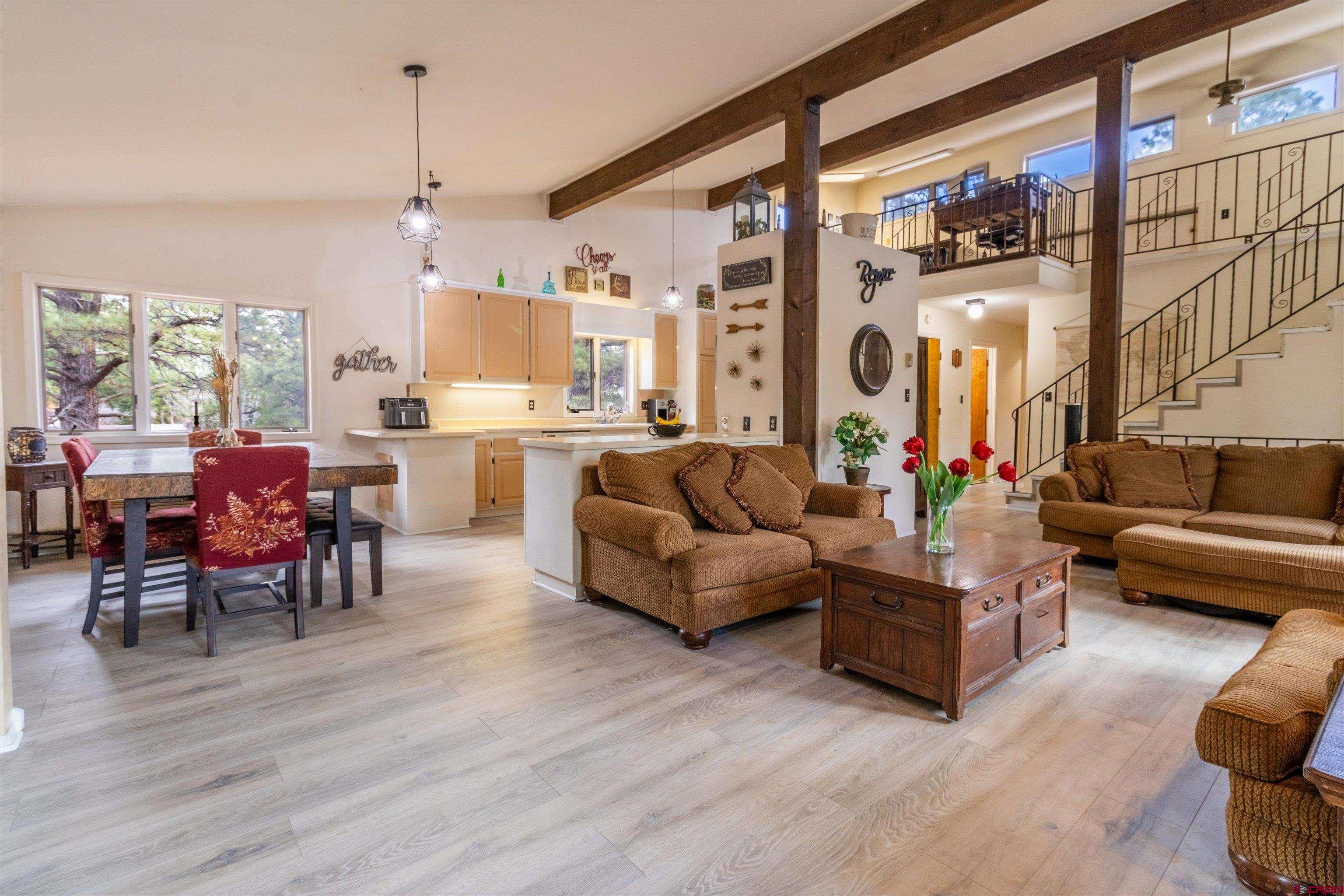 67 Pine Ridge Loop Durango, CO 81301 - Photo 5 of 35 a living room with furniture and wooden floor