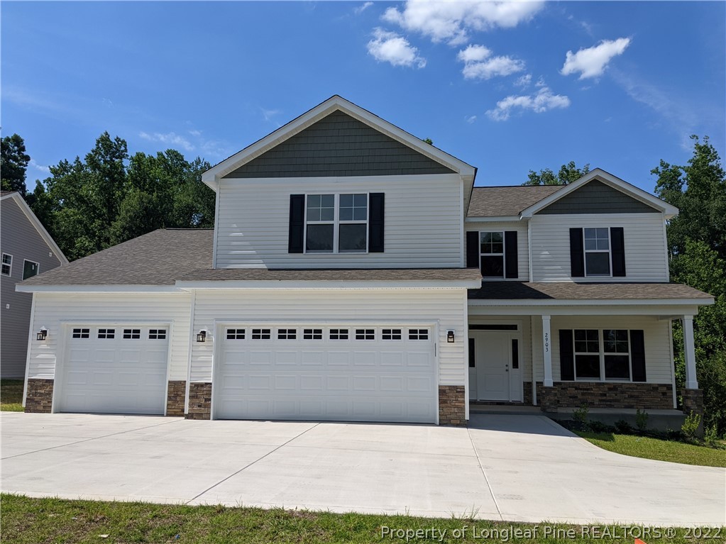 2903 Rockfish Road Raeford, NC 28376 - Photo 1 of 28 a front view of a house with a garage