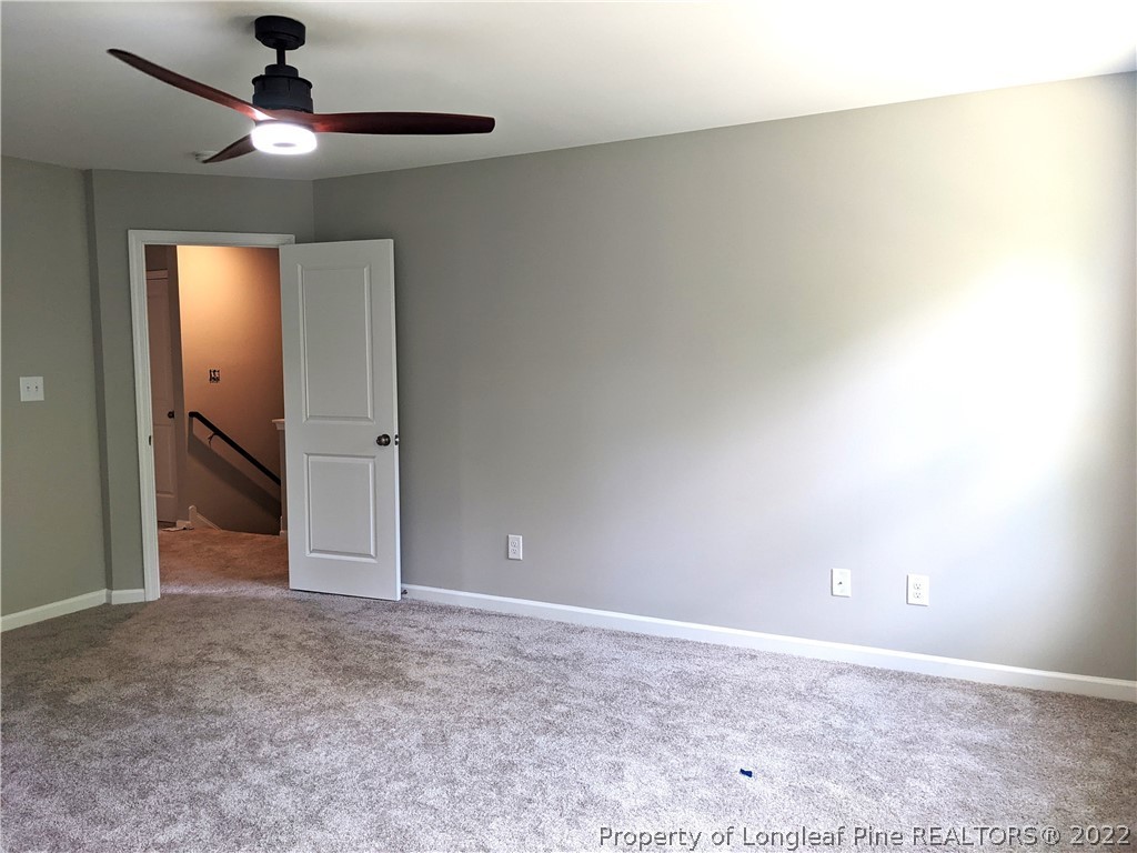 2903 Rockfish Road Raeford, NC 28376 - Photo 22 of 28 a view of an empty room and chandelier fan