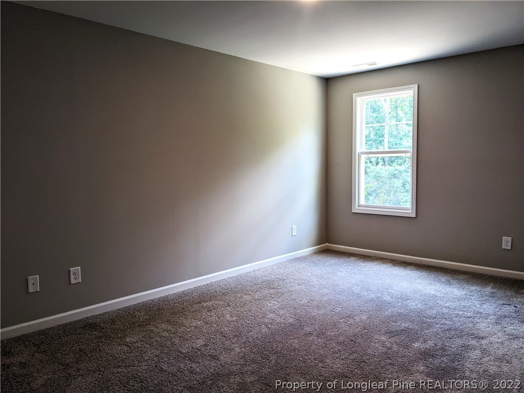 2903 Rockfish Road Raeford, NC 28376 - Photo 27 of 28 an empty room with windows
