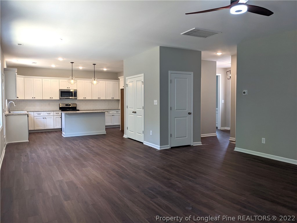 2903 Rockfish Road Raeford, NC 28376 - Photo 7 of 28 a view of a kitchen with wooden floor