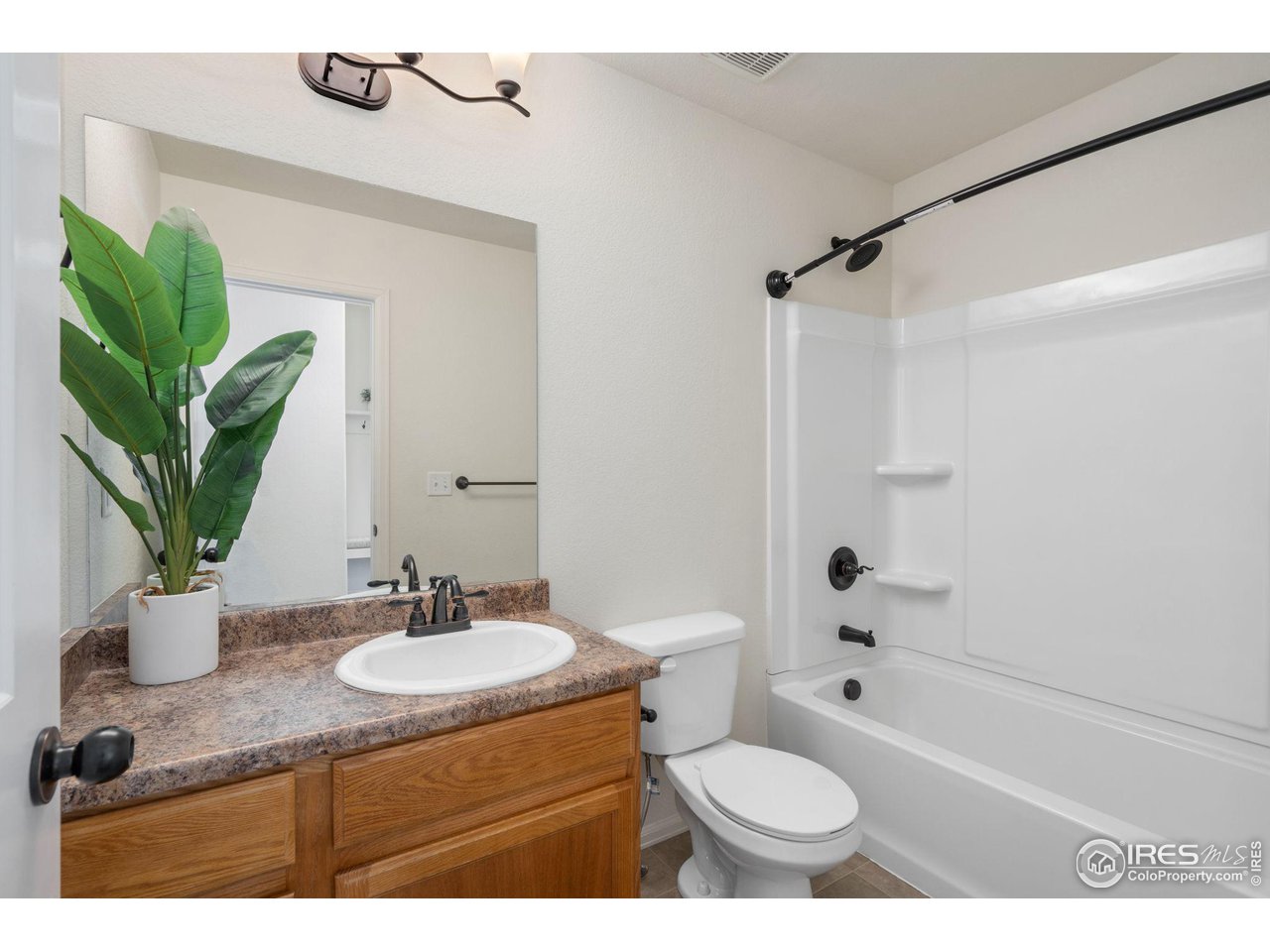 1663 88th Court Greeley, CO 80634 - Photo 17 of 28 Guest bathroom