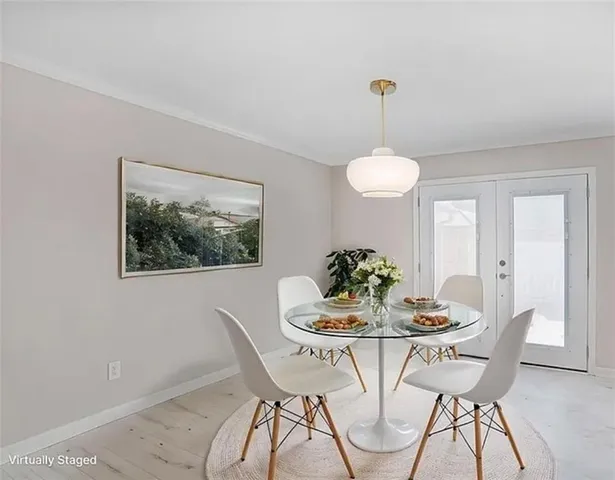 a dining room with furniture and window