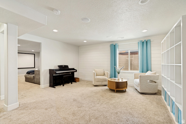 983 West 1550th Street South Springville, UT 84663 - Photo 31 of 43 Spacious family room featuring recessed lighting, shelving unit, and shiplap accent wall.
