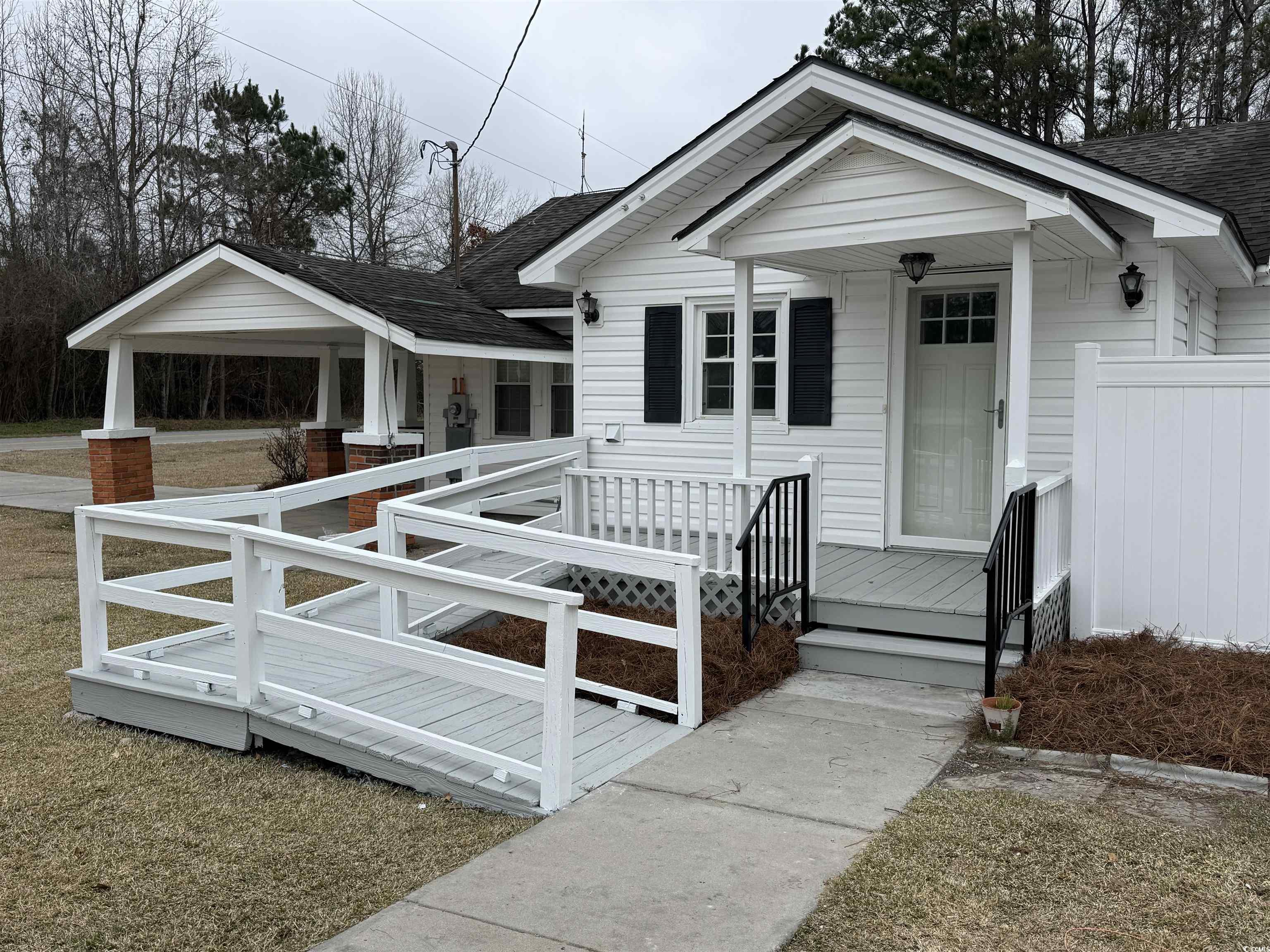 5724 Norton Road Green Sea, SC 29545 - Photo 20 of 20 View of front of home featuring roof with shingles and covered porch