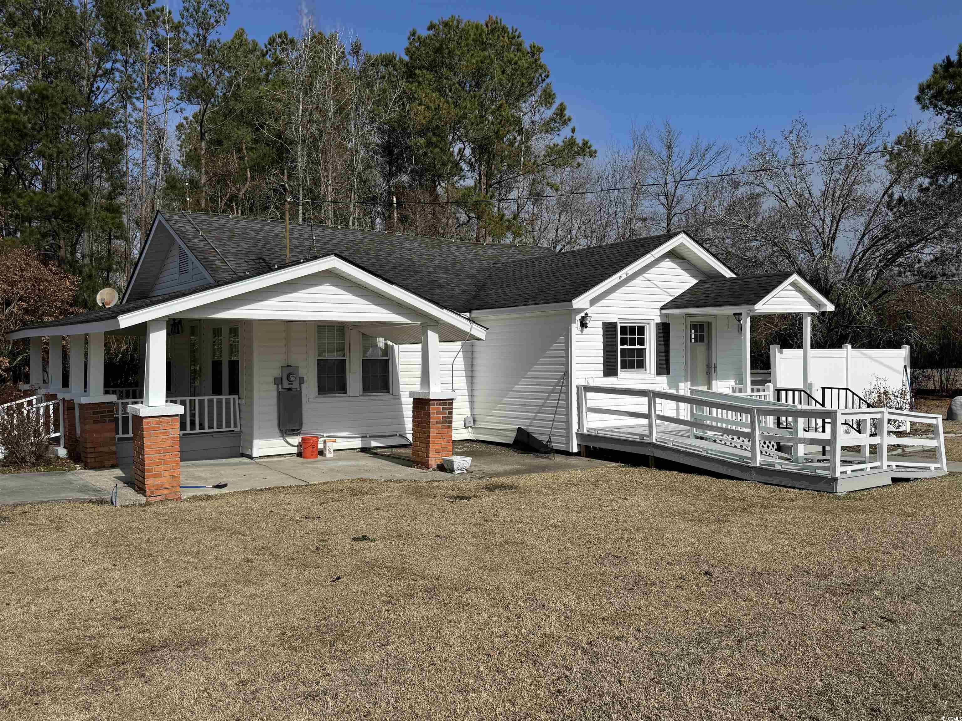 5724 Norton Road Green Sea, SC 29545 - Photo 2 of 20 View of front of home featuring covered porch and roof with shingles
