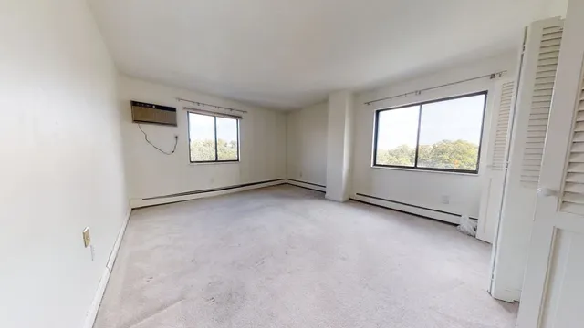 an empty room with windows