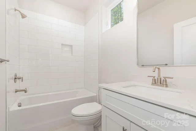 a bathroom with a sink a toilet and a bathtub