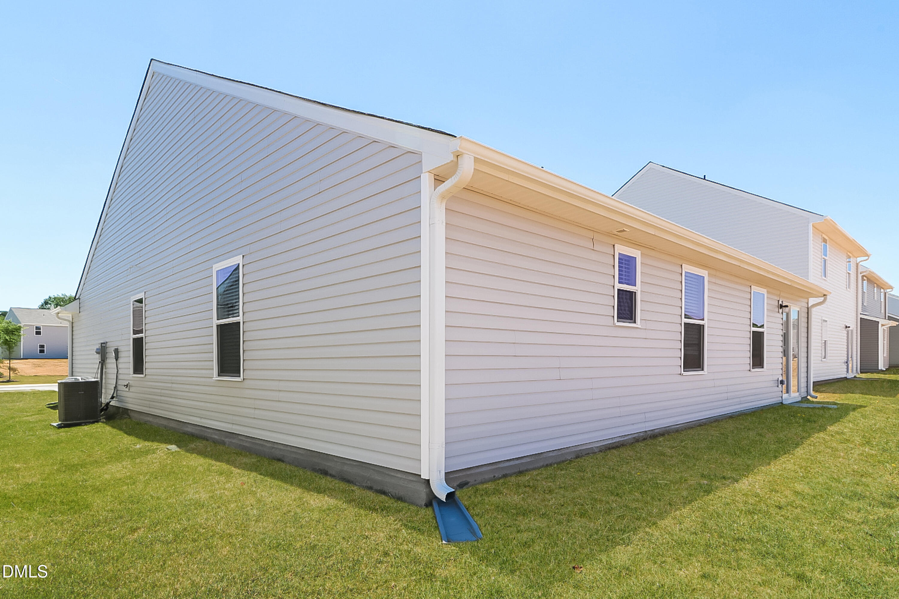 421 Brisk Drive Zebulon, NC 27597 - Photo 15 of 16 a view of a backyard with a garden