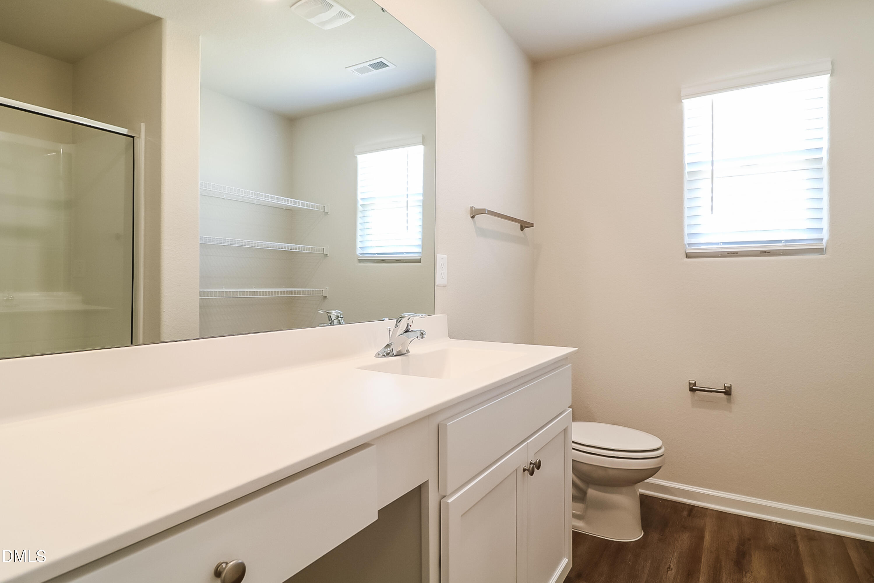 421 Brisk Drive Zebulon, NC 27597 - Photo 10 of 16 a bathroom with a sink a toilet and a window