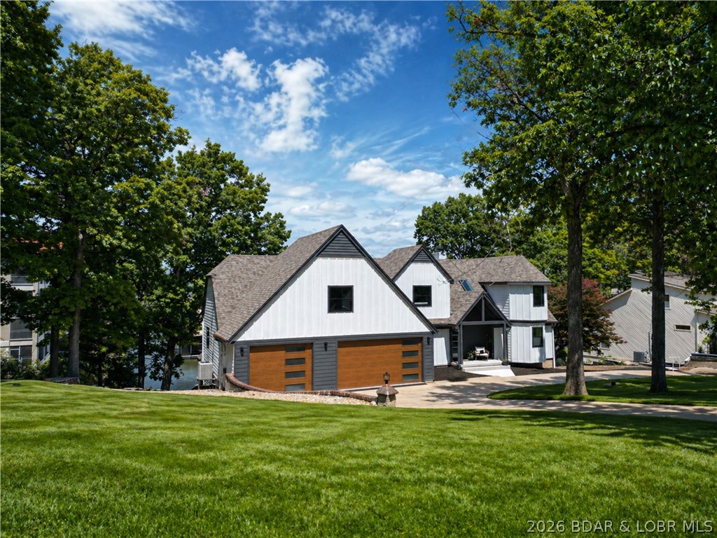 1729 Chimney Point Sunrise Beach, MO 65079 - Photo 10 of 78 Front of House + Spacious Yard