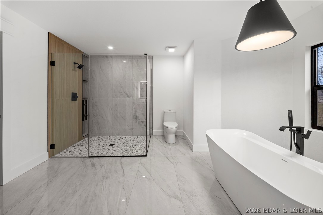 1729 Chimney Point Sunrise Beach, MO 65079 - Photo 25 of 78 Soaking Tub + Walk-In Shower