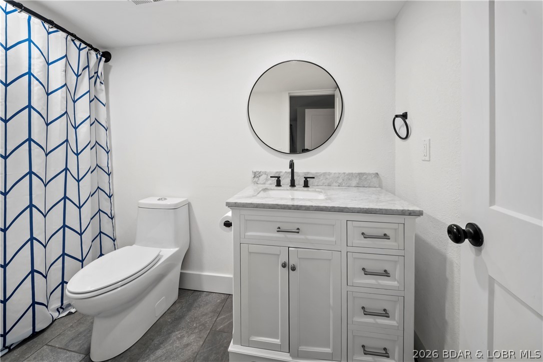 1729 Chimney Point Sunrise Beach, MO 65079 - Photo 54 of 78 En-Suite Bathroom on Bottom Level