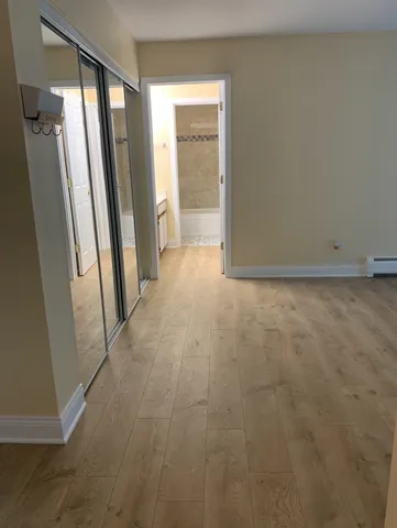 a view of a kitchen cabinets and a stove top oven