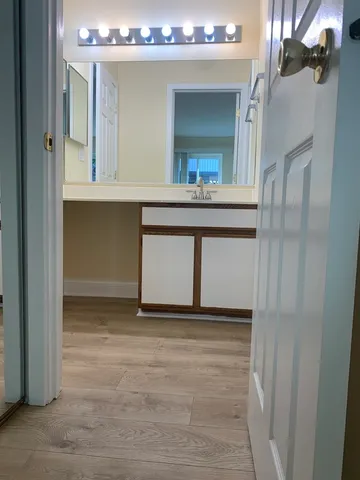 a bathroom with a double vanity sink and mirror