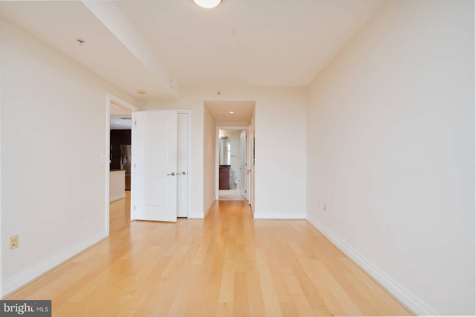 8220 Crestwood Heights Drive, Unit 714 McLean, VA 22102 - Photo 14 of 34 a view of an empty room with wooden floor