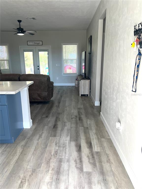 7746 Southeast 70th Avenue Trenton, FL 32693 - Photo 2 of 13 a living room with furniture and a fireplace