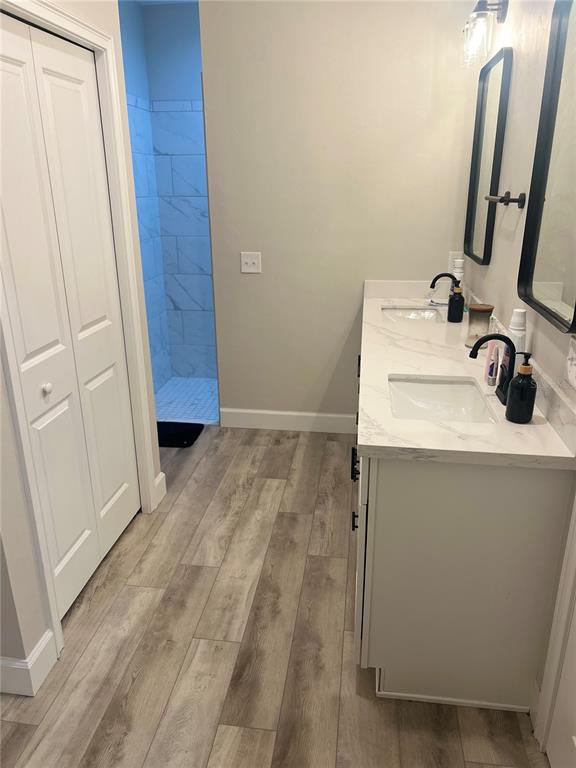 7746 Southeast 70th Avenue Trenton, FL 32693 - Photo 6 of 13 a bathroom with a sink and mirror with window