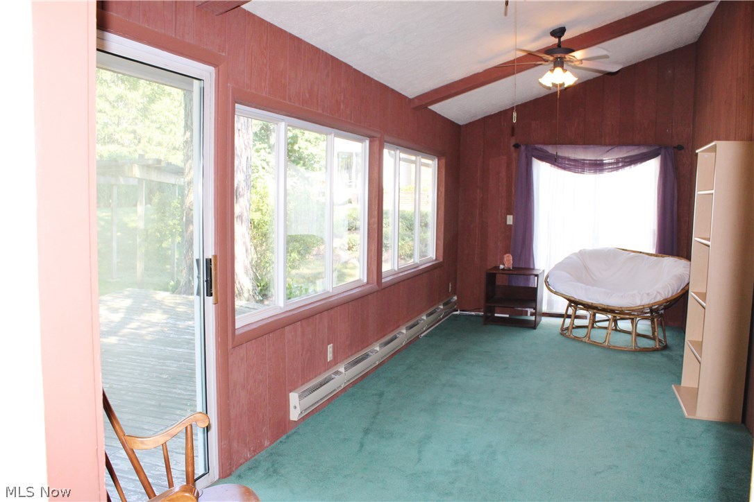 1825 Walnut Road Kent, OH 44240 - Photo 7 of 23 Note the vaulted ceiling and electric baseboard heat in the sunroom. There are also 2 ceiling fans- but no AC. Open the windows, turn on the fans, or crank up the electric baseboard heat and enjoy this space year round! Exit to the deck- it needs some refurbushing, but could be perfect entertaining space.