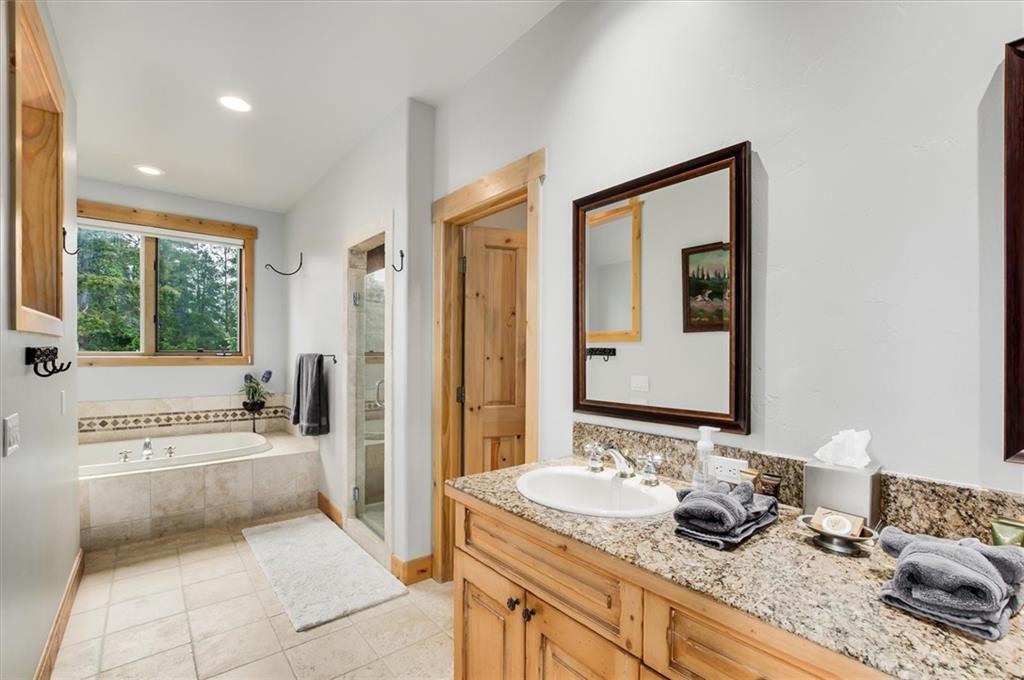 15 Rounds Road Breckenridge, CO 80424 - Photo 20 of 34 a en suite bathroom with a granite countertop tub and a sink