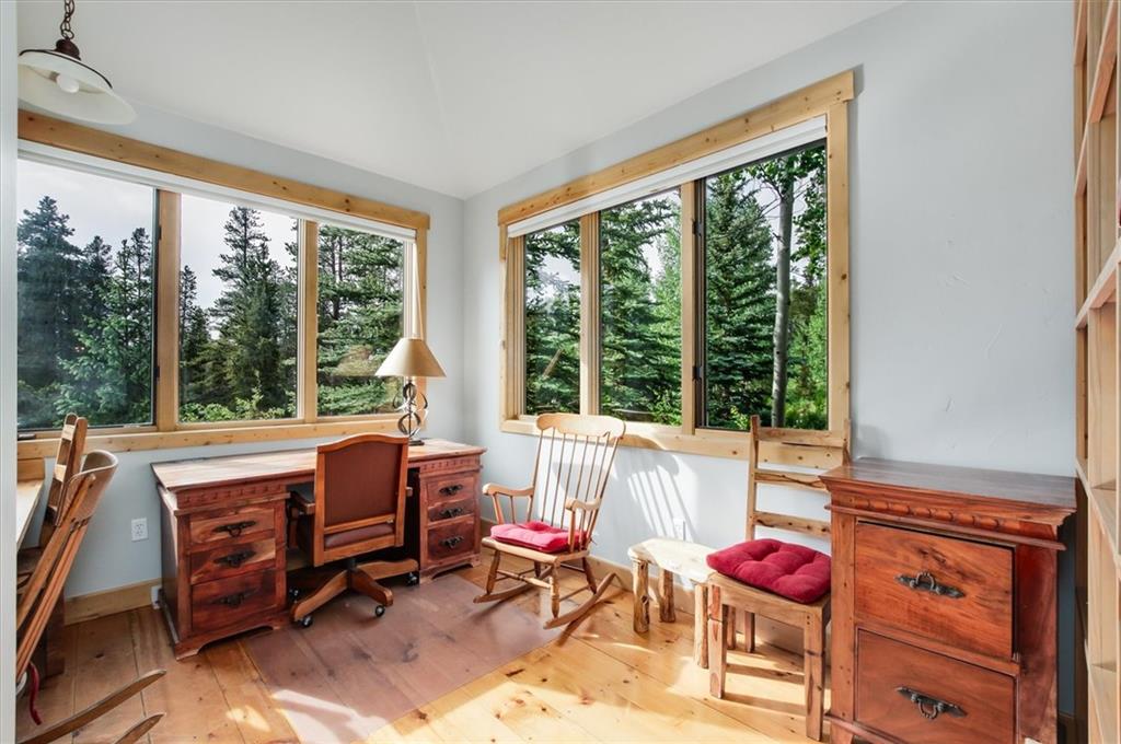 15 Rounds Road Breckenridge, CO 80424 - Photo 22 of 34 a living room with furniture a floor to ceiling window and a table
