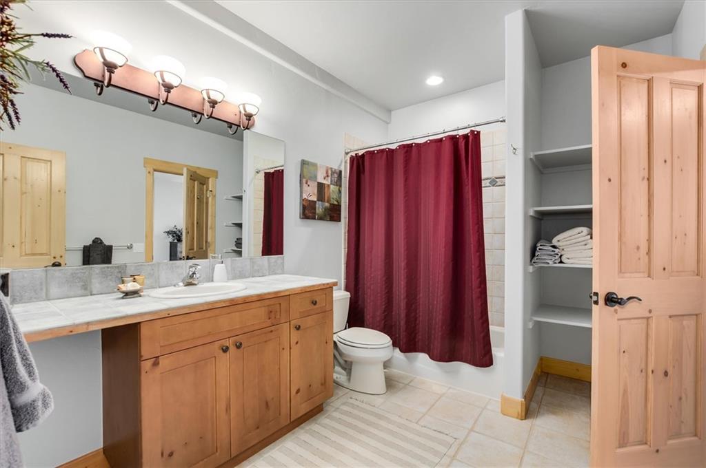 15 Rounds Road Breckenridge, CO 80424 - Photo 30 of 34 a spacious bathroom with a double vanity sink toilet mirror and shower