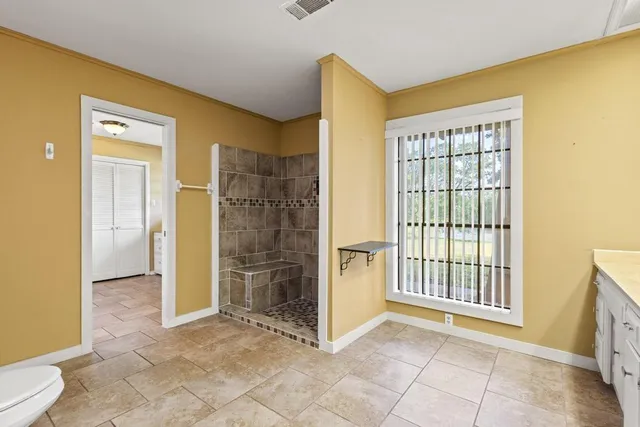 a view of a kitchen with a sink and a fireplace