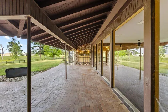 a view of a swimming pool with an outdoor space and seating area