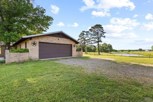 an aerial view of a house with a ocean view