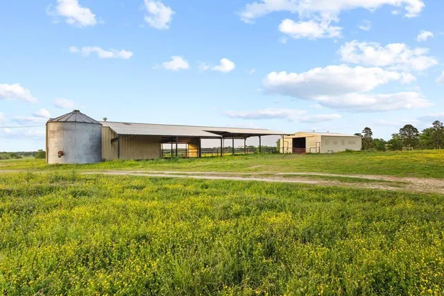 a view of a house with a big yard