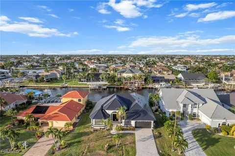 an aerial view of a house with a ocean view