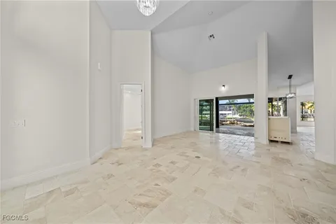 a view of empty room with natural light