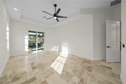 a view of a livingroom with a ceiling fan and window