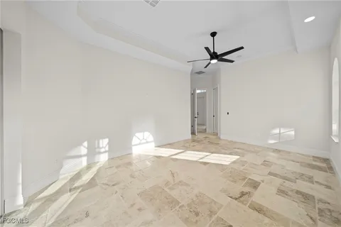 a view of empty room with a ceiling fan