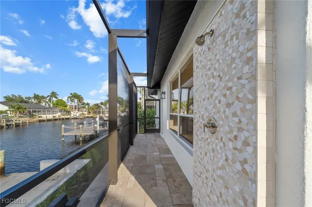 a front view of a house with swimming pool and a yard