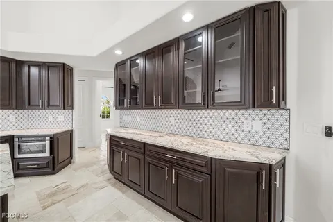 a kitchen with stainless steel appliances granite countertop a sink stove and oven