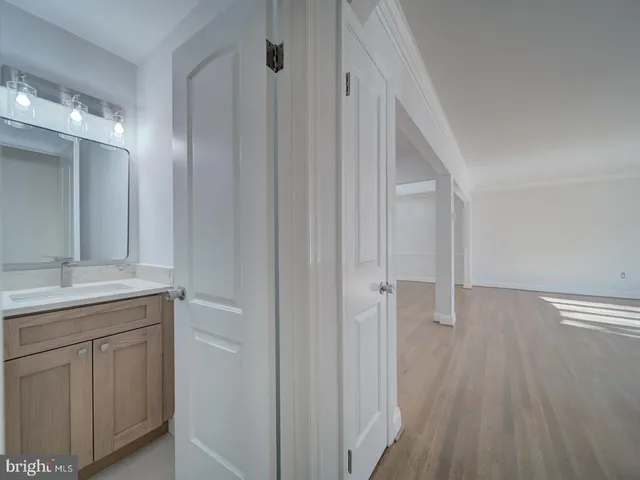 a bathroom with a sink and mirror