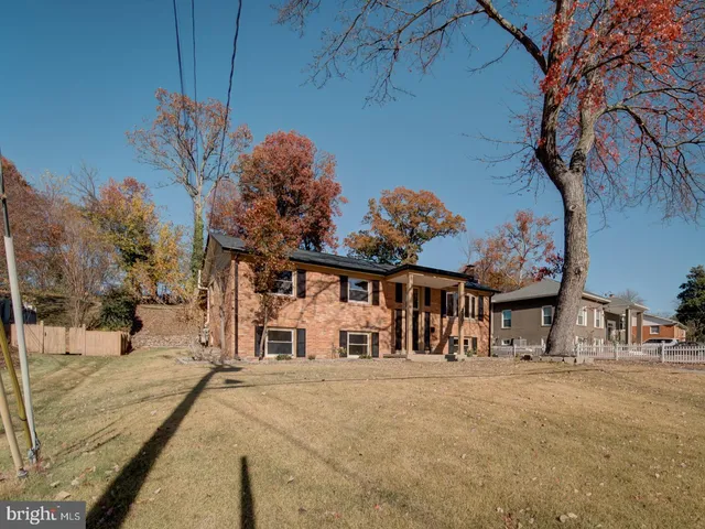 a view of a house with a snow on the road