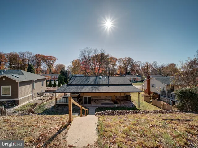 a view of a backyard with wooden fence