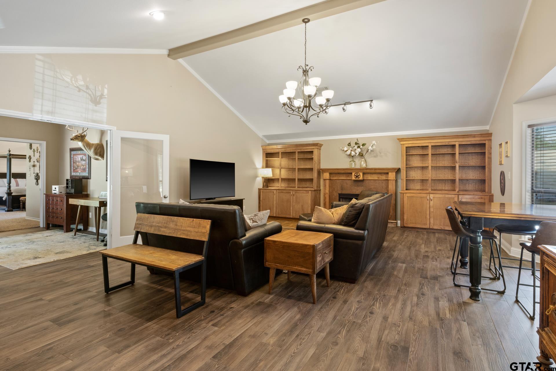 259 County Road 2407 Pittsburg, TX 75686 - Photo 19 of 42 a living room with furniture flat screen tv and wooden floor
