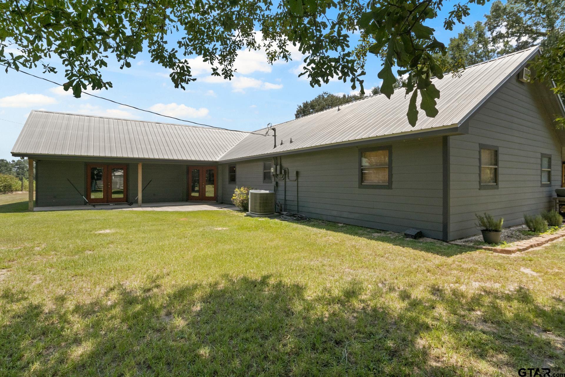 259 County Road 2407 Pittsburg, TX 75686 - Photo 36 of 42 a front view of a house with a yard