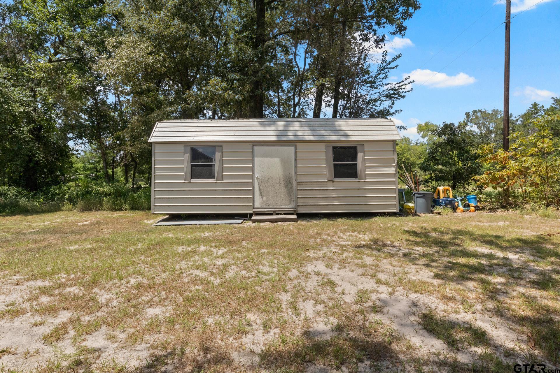 259 County Road 2407 Pittsburg, TX 75686 - Photo 40 of 42 a view of a house with a yard
