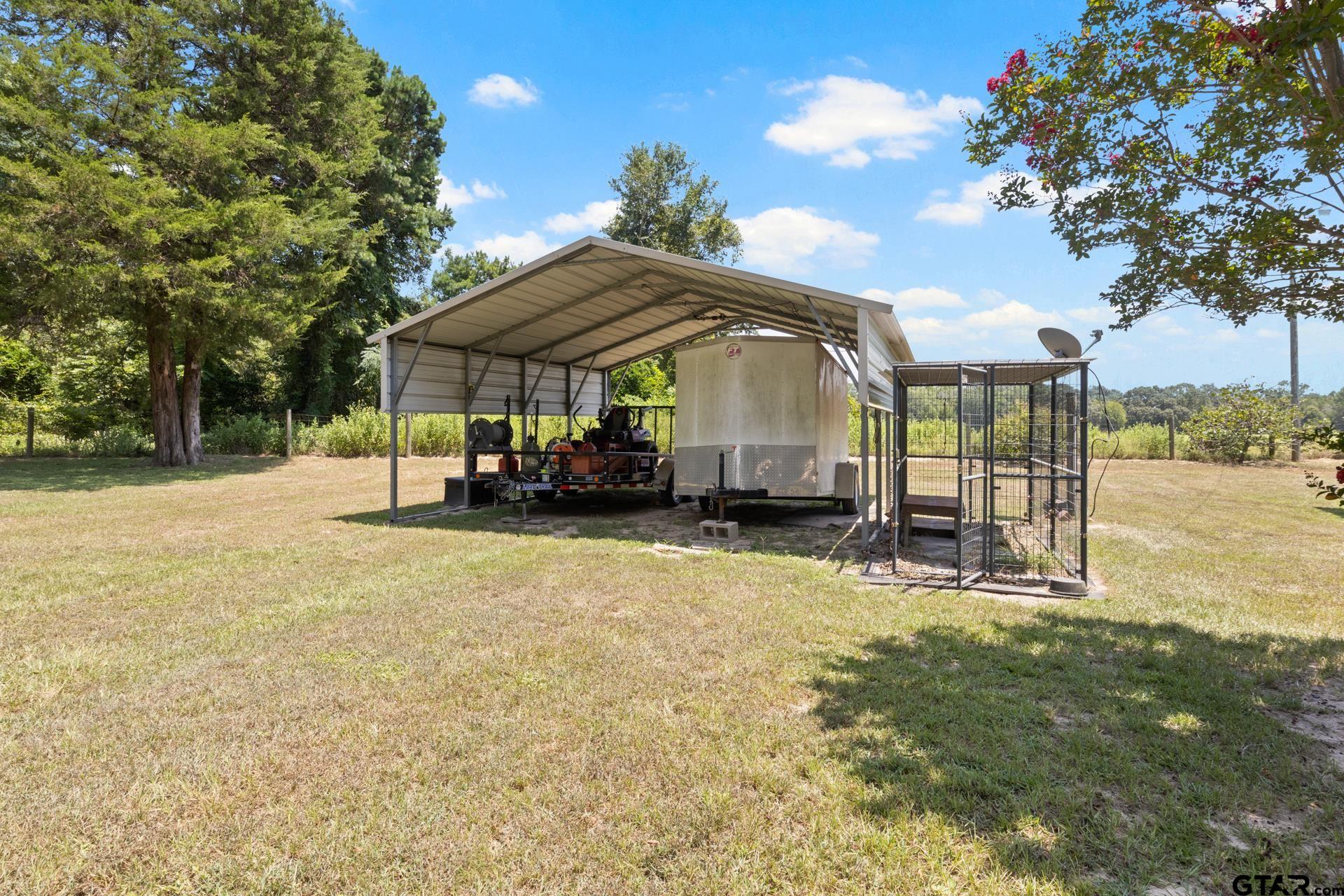 259 County Road 2407 Pittsburg, TX 75686 - Photo 41 of 42 a view of a house with a yard