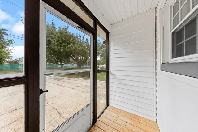 a view of a large window with wooden floor