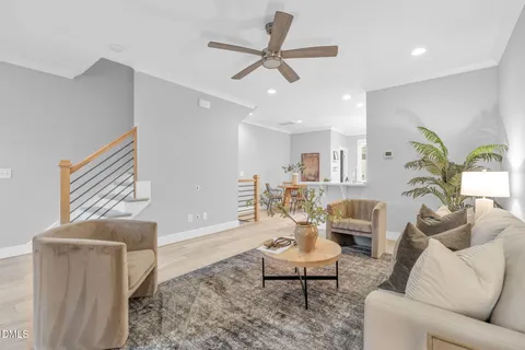 a living room with furniture a window and a fireplace