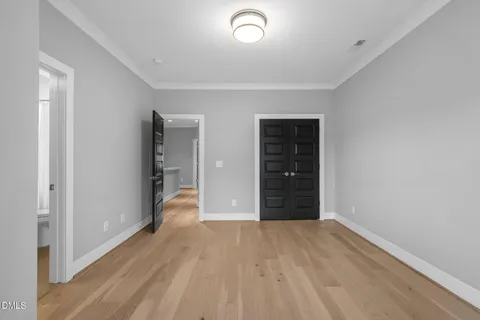 wooden floor and closet in a room