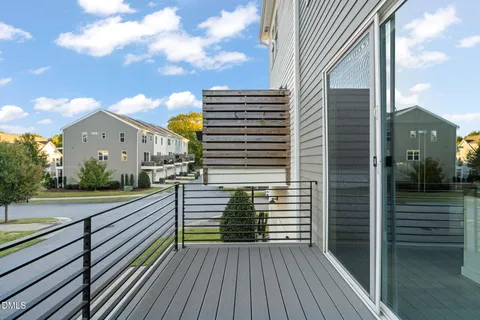 a view of a balcony with wooden floor